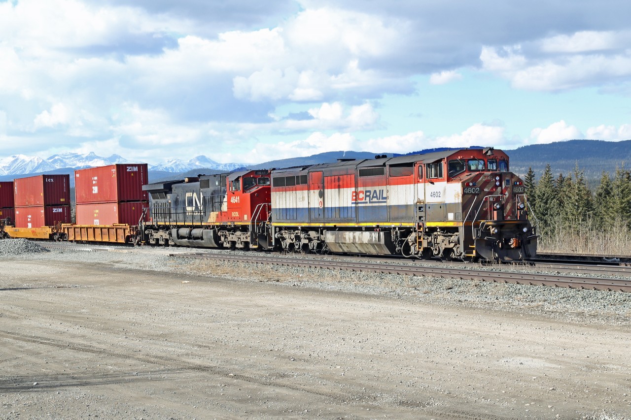Two ec BC Rail locos wait at Hinton with an eastbound intermodal.