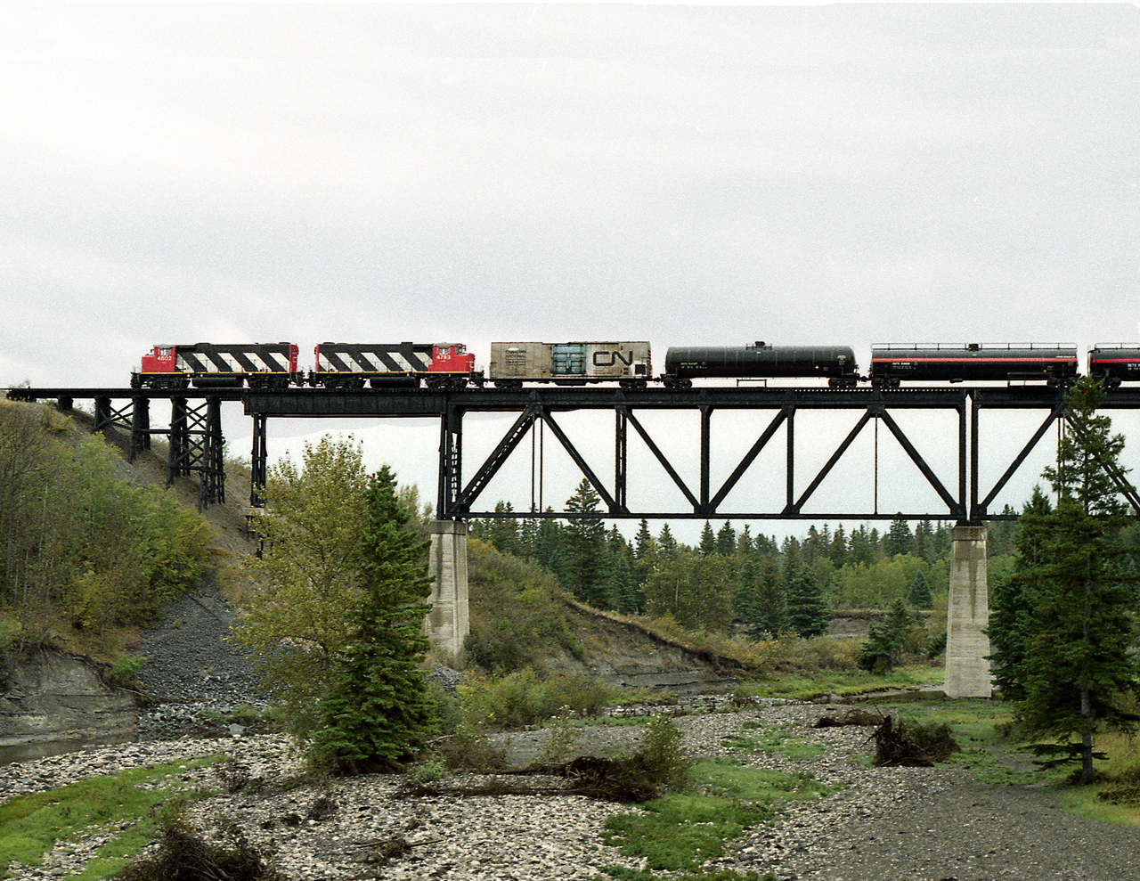 CN's Red Deer switcher returning to Red Deer Junction after picking up cars from the Edmonton - Joffre turn crosses the Red Deer River on the northeast side of the city.