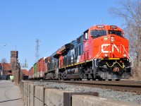 Brand new CN ET44AC 3063, along with CN 2853 lead 394 with 146 cars through Brantford on a sunny April morning