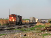 CN SD50F 5526 and SD75I 5785 motor west through "old" Peel on #149, fresh out of the Brampton Intermodal Terminal. The train stretches out in the distance, under the busy Highway 410 overpass that evening commuters zip home over without a glance down.
<br><br>
The small yard hidden on the right once held autoracks for the old AMC Brampton Assembly auto plant at Steeles and Kennedy, where the Peel Village Industrial Lead once ended. It still serves three remaining customers. Before Highway 410 was built decades ago, Heart Lake Road ran in its place over the tracks at a lowly crossing (parts still exist as a service road).