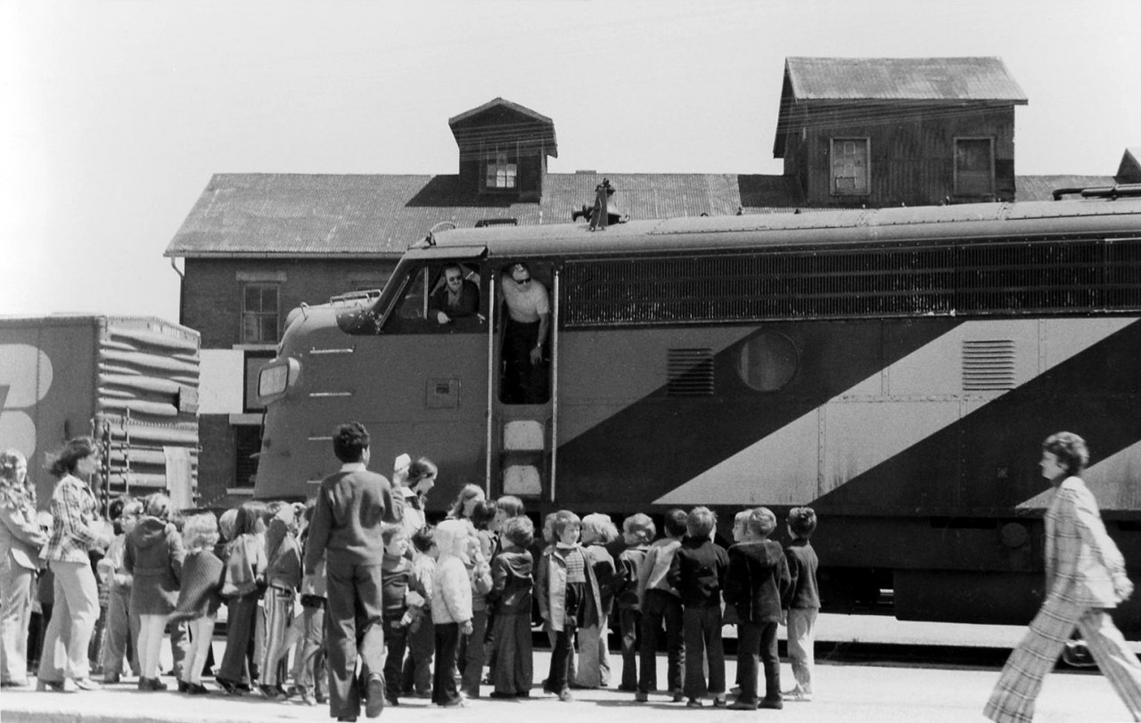 School children are on an outing to see a train at Guelph Station in 1972, as the crew of this train at the station look out of the cab of their lead CN FP9 at the crowd gathered around. I wonder if any of the kids became railfans.