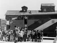 School children are on an outing to see a train at Guelph Station in 1972, as the crew of this train at the station look out of the cab of their lead CN FP9 at the crowd gathered around. I wonder if any of the kids became railfans.