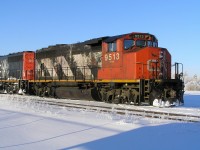 The CN train was stopped on the main line through Vegreville AB. An event that did not happen that much but when it did it sure annoyed the people traveling north or south through town. In this case, some of the crew had time to climb down from the locomotive,& obtain some goodies at the near by gas station. The temperature at the time was in excess -30c so I did not hang around to get any better shots. On the bright side there were no mosquitos to put up with!