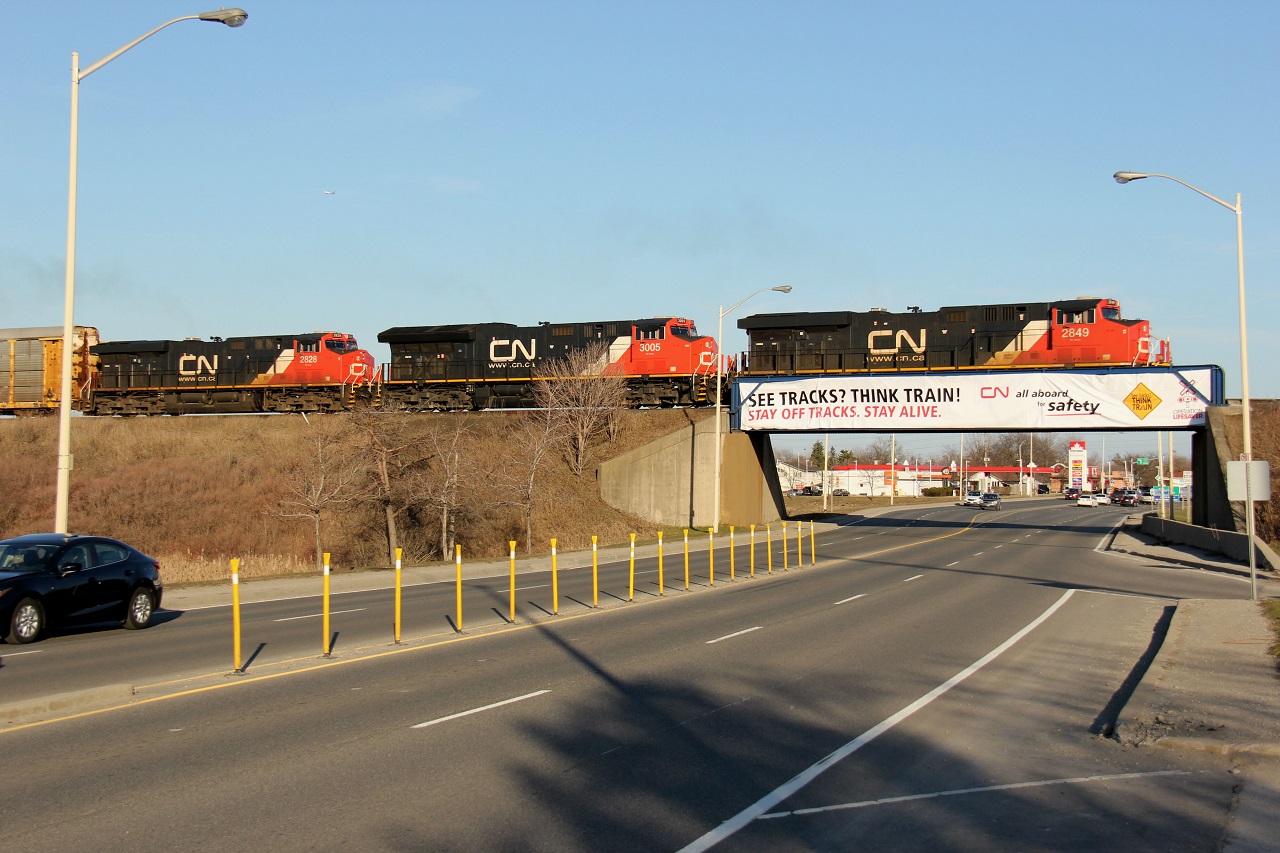 I found this banner draped over the CN overpass over Highway 25 in Milton interesting. After just missing CN 399 the previous day, I had a shot in mind. So, here it is... CN 399 with CN 2849-CN 3005-CN 2828 all elephant-style coasting westbound on the Halton Sub. For westbounds on this section of the Halton Sub, CN Millbase is one of your best choices for being well-lit. On the way home, I had to take advantage of our first real nice days of the year for sun and temps. Time, 18:40.