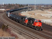After only a few weeks in service, CN 3050 rounds the curve at Whitby with 3004 and mid-train DPU 2831. The train had earlier stopped on the York Sub after 2831 had a penalty brake application. A brake reset and a quick message to the diesel doc later,  376 carries on as if nothing had happened. In the background, construction on GO Transit's new Whitby maintenance facility continues.