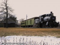 In the 1950's, the Government decided in an undertaking to widen the St. Lawrence River and make it part of the larger scale Seaway project. This meant most towns would be abandoned, and it's residents located to other nearby existing towns or newly created villages. Due to this decision, the CNR relocated it's trackage further inland. Most of it's original stations were demolished, and others were relocated. And still, new stations were built in a modern style of that time period. 
<br> 
Today it has become known in history as the Lost Villages. Aultsville was no exception. A small town on the Seaway, it was one of the towns selected to be razed, and it's former lands flooded. The station however, was preserved and moved to this display just beyond Morrisburg at Chrysler Park. 
<br>
The display is visible from Highway 2, which also includes an engine 1008 and two cars. This pays homaeage to the train nicknamed the Moccasin. Interesting note...from Morrisburg, Highway 2  follows a portion of the original roadbed. The original stone station in Morrisburg, used to stand at the main intersection of Hwy 2 and County Road 1, now occupied by a shopping center. 
