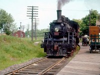 CN ten-wheeler 1135 is seen at Oxford Junction, Nova Scotia on June 20, 1955.  Bound for Pictou, NS, 69.2 miles to the east, the run was usually served by a gas-electric car but their diminishing reliability or, perhaps on this day, a heavy head-end load of parcels and packages accounted for the substitution of regular locomotive-hauled equipment.  Connection was made at Oxford Junction with Montreal - Halifax main line and local trains.