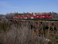 The Trenton Turn crawls through Cherrywood with roughly 4,800' of traffic, giving these two GP's all they can handle. The extra tonnage was due to 113 having to reduce their train on the previous day because one of their units failed.