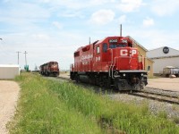 No shopping trip to Lloydminster is complete without dropping over to CP & CN yards and seeing what action is taking place. In this case I photographed CP 3040 sitting by the yard office. In behind CP 3040 were CP 6012, CP 6023, & CP 9008. The camera is pointed east looking into Sask. If I had backed up about 200 ft. I could have taken the shot from Alberta. Couldn't have asked for better weather! A slight breeze & no mosquitos.