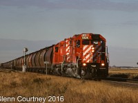 CPR SD40-2 5926 leads an eastbound loaded grain train on CPR's northern line across the prairies. 
