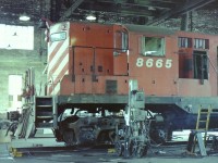 Knowing that the CP operations at the Drake St. yards were coming to an end my friend (Jack Lord) & I drove down to the yards on a nice sunny day. I remember that it was a Sunday & no work was taking place. We took as many photographs as we could till we ran out of film. In this case we spotted CP 8665 jacked up in the newer portion of the roundhouse, so being careful not to touch anything we took a couple of shots showing the locomotive as it sat there. The sad thing is that there was so much more to photograph & we missed it.