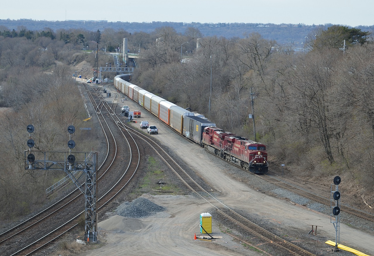 Looking down from high above, CP 247-24 rolls northbound on the Hamilton Sub after meeting 246-24, southbound, at Desjardins.  The 99 car train, led by typical GE's, proceeded slowly, but loudly; with horn blaring, through the construction zone.
