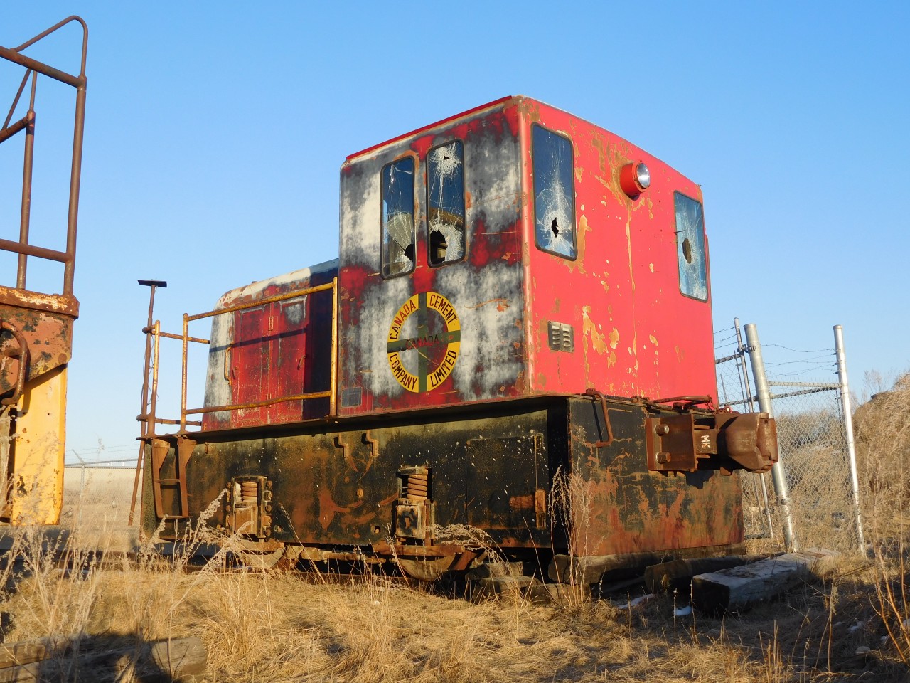 A Canada Cement red GE 15T is seen sitting in the Fort Garry industrial as it has for many years.