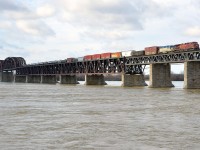 <b>Bringing in a D&H unit for servicing.</b> DH 7304, One of two remaining units on the CP system still sporting the D&H lightning stripe paint scheme, is trailing on CP 253, with CP 8603 leading as the train crosses the St-Lawrence River. DH 7304 is en route to St-Luc Yard for routine servicing.