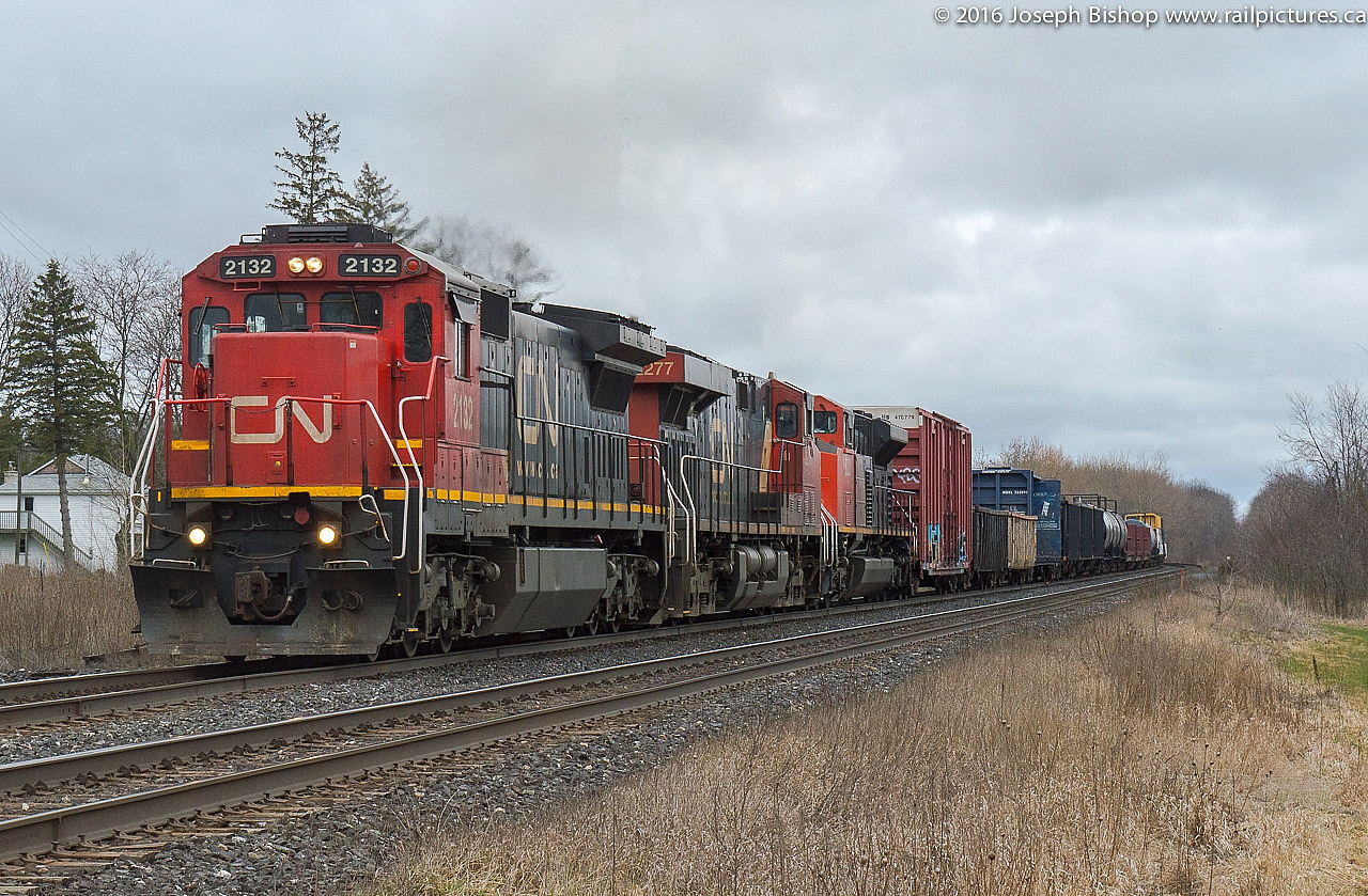 CN 394 hustles through Lynden with CN 2132, CN 2277 and CN 8023 on a dreary April 1st 2016.  Ever since CN purchased these units second hand a few years ago they have been one of my favourite engines to photograph.  This is my 400th photo on Railpictures.ca and featuring one of my favourite units seems fitting.