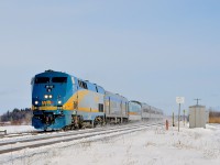 <b>VIA 63 with a mixed consist.</b> VIA 63 is westbound through Les Cèdres with VIA 910 leading 5 stainless steel cars and 1 LRC car.