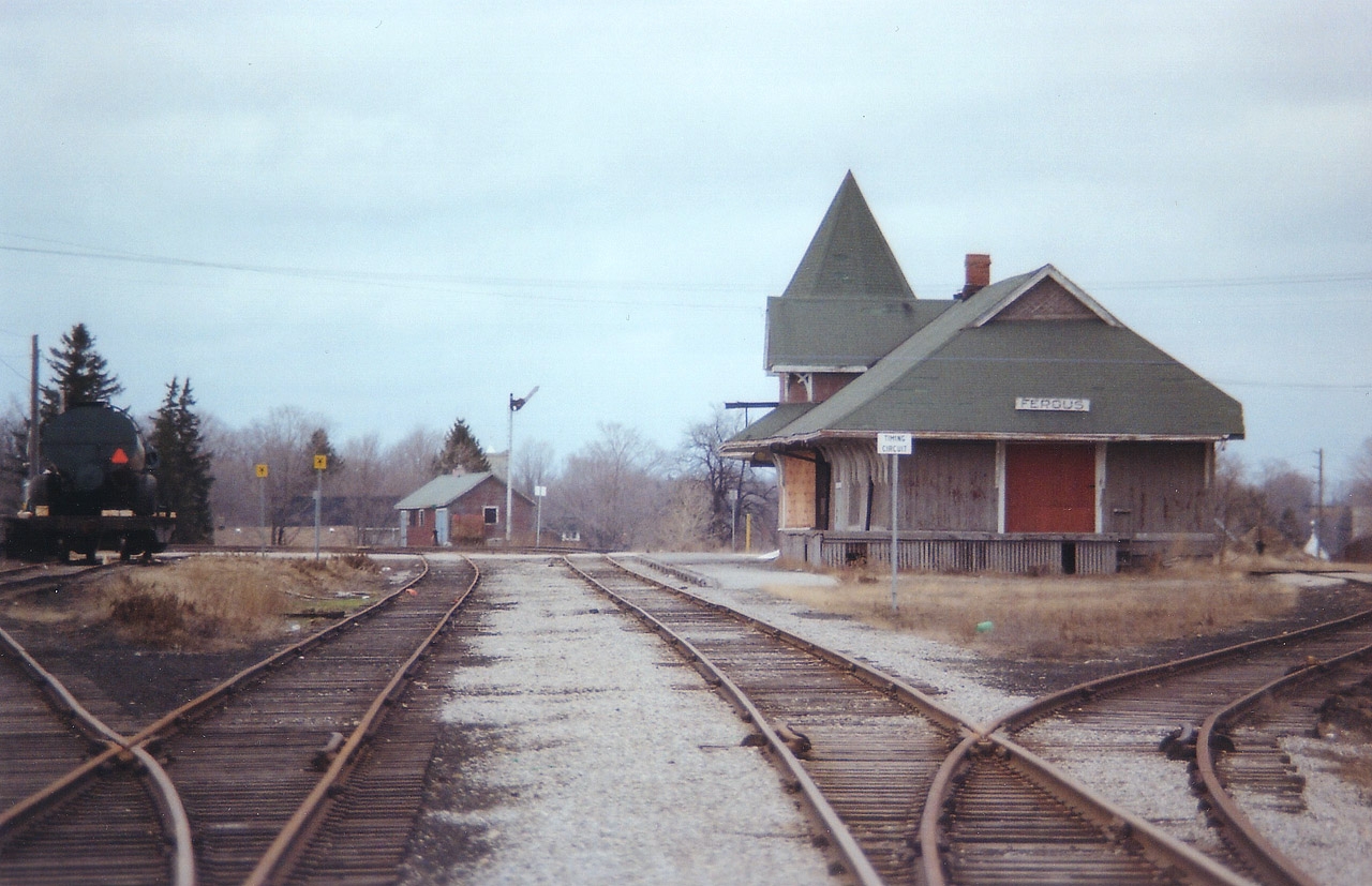 Here is another one of those 'out in the boonies' stations I hunted down many years ago. Unfortunately, I was so busy running around I kept poor notes. The CN line thru here, Guelph to Fergus over to Palmerston to Kincardine, began life in 1870 as the Wellington, Grey & Bruce. CP also ran thru Fergus, a branch line over from Cataract on the Credit Valley Rwy in 1879 reached Elora. (CP took over the CVR in 1883). All that is needed is someone with the knowledge of Fergus (are you out there, D.A.Y.??)to explain this scene. Today all track has been removed, as well as the "Grimsby-lookalike" station. CP had a station nearby as well, but it was demolished in the early 1970s. An interesting view this is, of old Ontario branchline railroad.