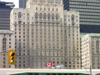 <b> TIME MACHINE MATERIAL??? </b> While on a day trip to Toronto in 2010, I captured the ever changing skyline in downtown Toronto. What brought this memory about was seeing Dave Beach's photo from 1978 of the Canadian parked at Union Station, with the Royal York hotel as a backdrop.
<br>
I am hoping this will be considered for the Time Machine contest - as this was a difficult photo to have taken. I never knew about Dave's photo until only recently. And the changes are obvious.
<br>
My angle of the Royal York is different than what Dave captured back in 1978. That's because much has been built up on the former yards of the CP...as urban sprawl now seems to rule the lands (hence why there is a streetlight and a traffic signal in my photo). Roundhouse Park is a tribute to the former days of Toronto railroading, and well worth a visit. Thankfully Dave captured an era coming to an end...CP and CN handed over passenger services to VIA...and GO was created almost around the same time as VIA. And from Dave's photo to mine, much has changed on the Royal York. It is no longer 'railway owned', although still the premier hotel of Toronto's downtown core.
<br>
You can see Dave Beach's photo here <a href="http://www.railpictures.ca/?attachment_id=20439"> http://www.railpictures.ca/?attachment_id=20439 
