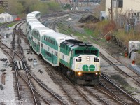 <b><i>More from 8 years on this day...</i></b> GO Transit F59PH class-unit 520 (the first '59 built by GMD/EMD, builder's plate stamped S/N A-4745 built September 1988) cruises through the switches at Bathurst Street, bringing the passengers of morning Georgetown line train #206 into downtown Toronto for another workday.<br><br>520 had less than a year left at this point - she was sold to RB Leasing in March of 2009, and went on to serve VIA, AMT and Metrolink as a leased commuter unit. The Quality Meat Packers abattoir/slaughterhouse on the right lasted longer, but eventually closed in 2014 after operating decades in that location. And Strachan Avenue crossing in the background has since become a giant hole in the ground (literally...grade separation).