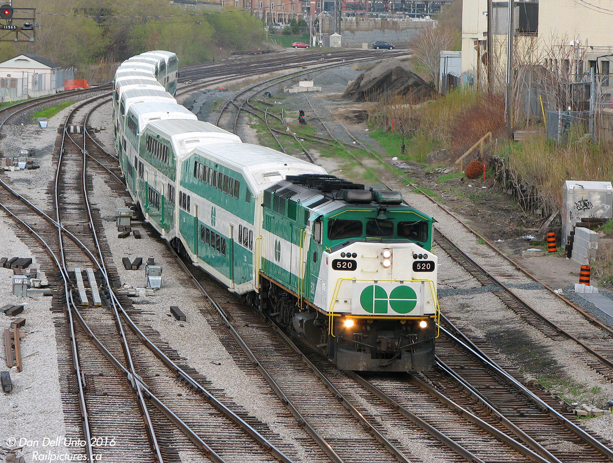 More from 8 years on this day... GO Transit F59PH class-unit 520 (the first '59 built by GMD/EMD, builder's plate stamped S/N A-4745 built September 1988) cruises through the switches at Bathurst Street, bringing the passengers of morning Georgetown line train #206 into downtown Toronto for another workday.520 had less than a year left at this point - she was sold to RB Leasing in March of 2009, and went on to serve VIA, AMT and Metrolink as a leased commuter unit. The Quality Meat Packers abattoir/slaughterhouse on the right lasted longer, but eventually closed in 2014 after operating decades in that location. And Strachan Avenue crossing in the background has since become a giant hole in the ground (literally...grade separation).