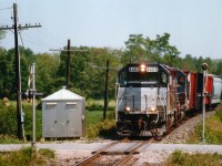 What a difference the years make !!!  This is a CP train, westbound at the Victoria AV crossing, on approach to Puslinch. Power, both leased, are HLCX 4406, GP40 CLC (x-Amtrak 651) and HATX 518, GP40u (x-CSXT 6548). A leased unit leading on a Friday resulting in me leaving work early with a terrible sore throat (cough, cough). I marked this photo as the Galt Turn, but have forgotten if this was a train that worked west to Galt, or worked east out of Galt and is returning.