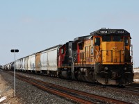 CN 2004 with the manifest for Winnipeg sit parked on the main wait for the log jam between Lestock and Melville to clear up before they began to move east. 