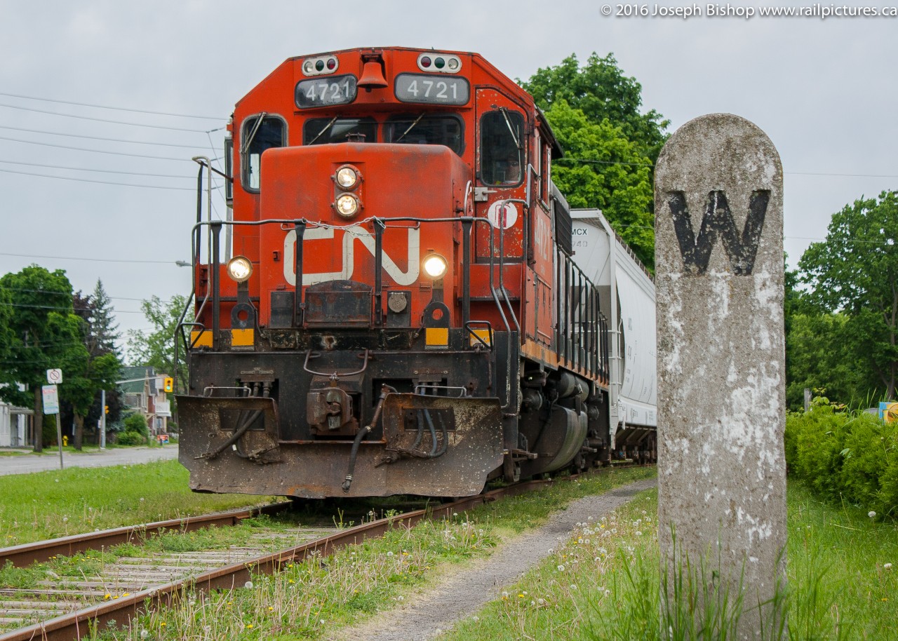 CN 580 trundles down the CN Burford Spur with CN 4721 on the point.  They are pictured passing an old concrete whistle post.  This whistle post fell over last winter and has not been replaced, a unique subject to photograph no longer useable.  On Wednesdays 580 would almost always be a good train to shoot on my lunch hour as they ran down the Burford Spur.