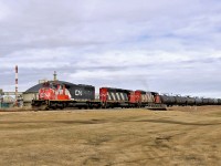 A trio of SD40-2(W)'s switching on the Fort Saskatchewan Industrial Lead. CN 5277, 5350 and 5275 had pulled a very long line of cars from the Dow Chemical Plant sidings and had come down to within a couple of hundred meters of the end of track at the city end.  Now seen pushing back to the Scotford Yard, 4 1/2 miles away.