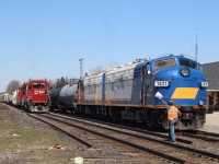 "Hooping" orders was once such a common sight in railroading, and apparently it is still needed even in today's modern world. A westbound local briefly stops at Woodstock, while the daily Ontario Southland run switches cars at the interchange. The mix of multiple generations of EMD locomotives here was also a nice change from the countless number of GE locomotives that usually pass through town.