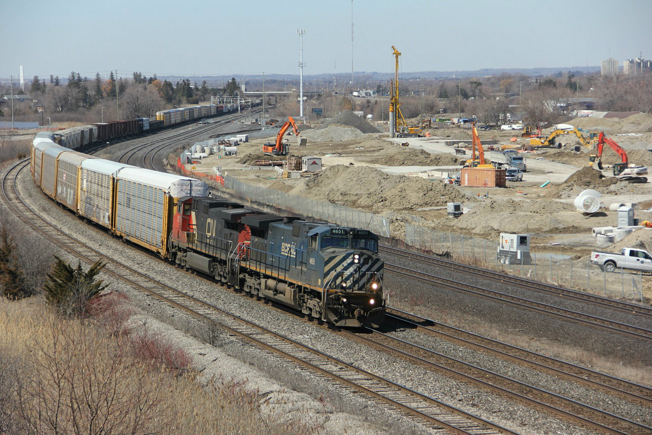 The first decent day in a while and well worth the wait. CN extra 372 being lead by BC Rail blues 4651 rounding the curve at whitby. With a large set off and lift at Oshawa there was plenty of time at different locations to photograph this rare and en-danged paint scheme.   Just a note, the Hopkins street overpass is now in the way of  construction at the new GO terminal and the new South Blair underpass is nearing completion.