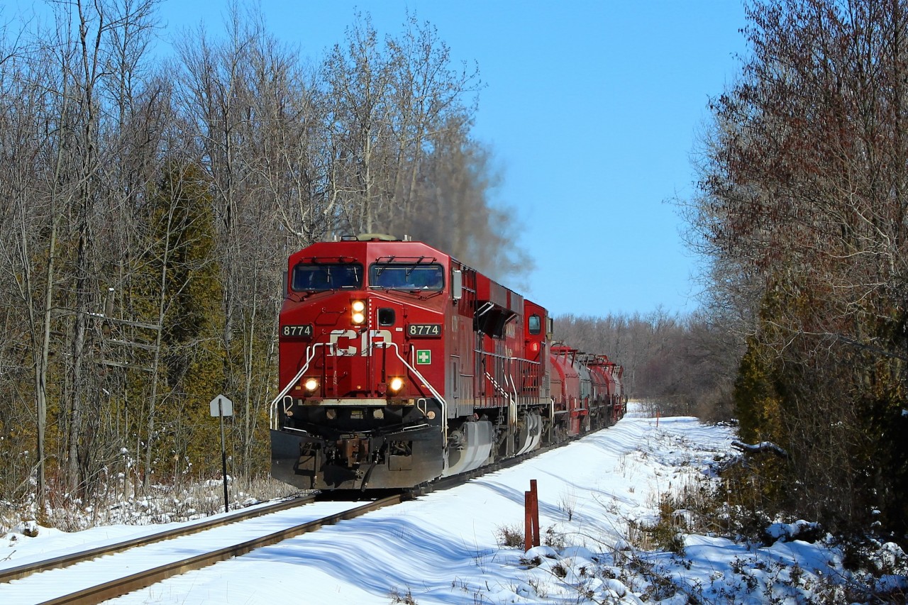 On a bright sunny but cold day, CP 246 with its 356 axels and 5164 feet of train, is led by CP 8774 down the Hamilton sub as they prepare to cross the Milburough Line and MM 72.52 cleared to Desjardins.