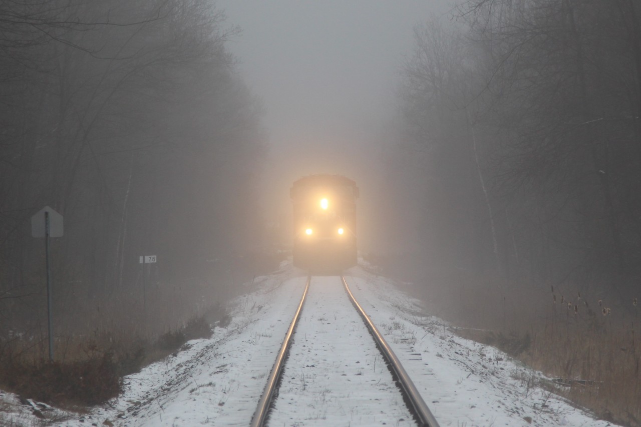 Out of the fog comes CP 247 with CP 8895 and CP 8911 for power on the last leg of its trip up the Hamilton sub approaching MM 76 and Guelph Junction.