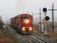  After waiting for CP 2259 to pass down the Puslinch siding, todays pickup train is lead by a trio of GP38AC's for power with CP 3065 on point and CP 3061 and CP 3130 helping out, as they make their way under the highway six overpass and past signal 449. A lot of construction gear and storage units have been brought in lately to this location for work on the signals and crossings down to Guelph Junction.