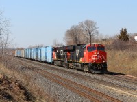 Two of CN's newer locomotives, CN 3001 and CN 3002,  power todays very short CN 562 up to MM 35.5 and prepare to go under the Lemonville Road overpass.