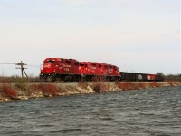 The daily pick up train with its trio of GP38AC's in CP 3130, CP 3061 and CP 3078 make their way over the Mountsberg causeway on a cold windy afternoon. While waiting for this trio to return from Guelph Junction, a pair of osprey were busy building their nest on the line pole at the front of the engines.