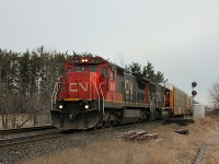 After a clear to stop signal appeared at the west end of Georgetown, we moved to try and find a better spot to shoot this thing. A foreman at Mile 22 called out the lead engine number; "CN 2121 west, passing red flag at Mile 22 Halton Sub, on the North Track." So I became a little more excited about shooting this.