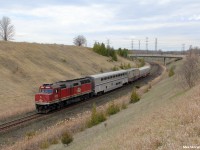 Test train O998 rolls down-grade past CN Beare with Canadian National F40 105 on point followed by Amtrak sleeper car AMTK 39037, CN 414852 and finally CN 1057. The train is en-route to Montreal testing various sections of track for defects.