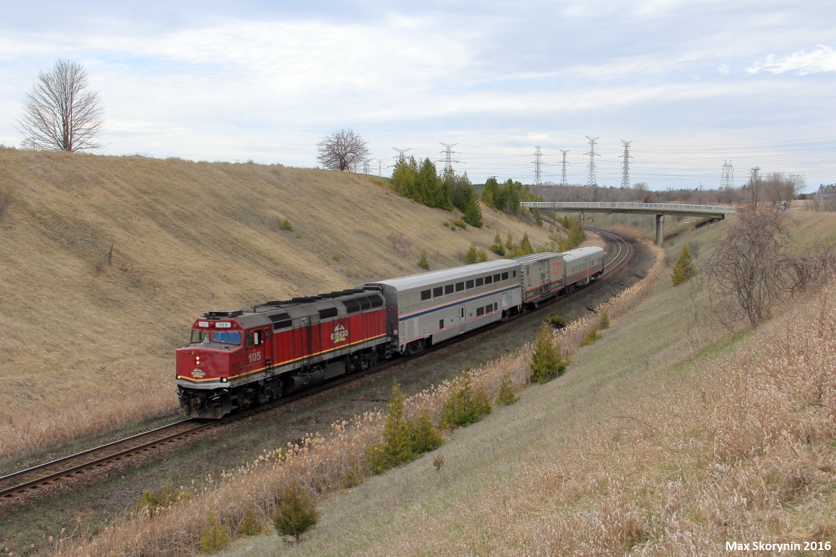 Test train O998 rolls down-grade past CN Beare with Canadian National F40 105 on point followed by Amtrak sleeper car AMTK 39037, CN 414852 and finally CN 1057. The train is en-route to Montreal testing various sections of track for defects.