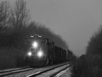 Chasing a pair of GEVOs has never been on my list of things to do, however, the blizzard on April 3rd got me chasing CN 330 from St. Catharines to Port Robinson. Something seemed particularly somber about this trip, but I never thought much of it. This would be the last CN 330 I may ever see, as it and its counterpart 331, were cancelled on April 6th, 2016. Here it passes Garner Road in Niagara with CN 2898 and 2829.<br><br>CN 330 began as a Buffalo-Toronto freight, with its counterpart 331 running the opposite direction. In the early 2000s they were rerouted out of Sarnia. By early 2008, the two trains were stubbed from Buffalo to Fort Erie. The 2008 recession mothballed them, and their remaining cargo was put on 338, 339, 421 and 422. They returned in October 2009, being stubbed further to Port Robinson, which seemed positive enough. However, shortly afterwards, 338 and 339 were slashed and have been gone since. CN added 232 as a relief autorack train to run as required, however rarely ran and still rarely does. Otherwise, things largely stayed the same until April 2015 when CN stubbed 421 and 422 from Fort Erie to Port Robinson, transferring all remaining marshaling operations there. The length of CN 330 and 331 had been in question ever since the St. Thomas Ford plant closed, meaning it no longer hauled autoparts cars from there, but especially more recently as they have constantly hovered around 50 cars.<br><br>CN 421/422 will no doubt have difficulty hauling 330/331's traffic, as both trains are already typically 130-160 cars long. Perhaps CN 232 will see more frequent usage, as well a possible counterpart train introduction for when 421/422 cannot handle all the traffic. Nonetheless, with GO Transit now pushing to buy the Grimsby Sub, it seems relatively predictable that CN could reroute its remaining traffic to the CP Hamilton Sub, especially with all the rumours going around this may occur, which was before GO even took great interest. As of now, the CN Grimsby Sub sits at four trains a day, Via 97/98, and CN 421/422. Just skeletons of what existed as recently as 15 years ago. It's sad to see, but Niagara is just one of many places between Canada and the U.S that has had this happen.