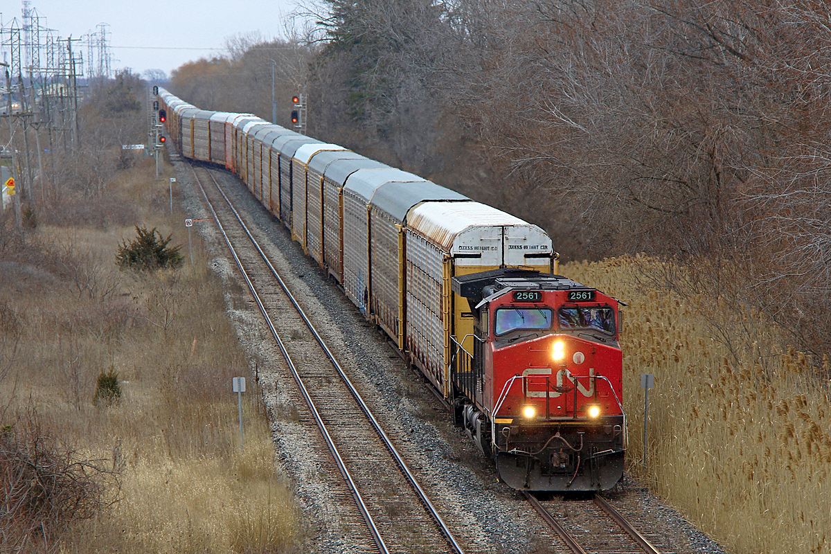 CN 330 and 331's demise has not been as much of a loss as originally expected to be. CN has added two trains, 523 and 524, although they are only as needed from what I hear. 524 only did an Aldershot-Toronto run on this day. However, either an extra load of autoracks was ordered for Oakville, or 232 was assigned to run in relief for 422. This particular 232 is made up of 73 empty multis. Here, it begins its trip on the south track from Nelles Road towards Hamilton. Whether it was Flint or Oakville bound is unknown to me, but ATCS suggested Oakville. If it was Oakville bound and operating in relief for 422, then perhaps there were CAMI bound autoracks in this consist to go along with the Ford's. Time will tell how CN's new Niagara operating plan works out, but so far it has shown unpredictability, which perhaps is a nice change from knowing approximately when every train is going to show up. So far more freights have been running into the sun, which is hard to come by in Niagara. This 232 showed up around 4pm, so it would have been a bright noselit shot if it wasn't snowing. Yes, the snow hasn't left yet, as you can barely make out by looking at the nose and plow of 2561. I personally don't mind, as winter barely even showed up when it was scheduled to!