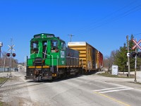 The Thorold South paper run had escaped my eyes for years, and has been able to maintain a very low profile as it has been poorly documented. This is train is operated for Resolute Forest Products by Trillium Railway, and brings pulp loads from the small CN interchange yard at Allanburg to the paper plant. While the owners of the plant have changed several times over the last several decades, the CN Conigas Spur and the paper run still exists today. Fellow contributor Arnold Mooney shot this train at this location about 34 years prior, and a few changes have occurred. The growth of trees, blocking the view of the mill, is the most obvious, which seems to have been the most common change in railfanning locations over the years.
<br><br>
http://www.railpictures.ca/upload/ontario-paper-4-is-shown-bringing-a-cut-of-pulpwood-cars-across-allanburg-rd-to-the-paper-mill-cns-daily-pulp-train-out-of-toronto-named-obviously-for-the-loads-on-the-head-end-has-set-off-t
<br><br>
This train was entirely caught by chance, and while I was in Port Robinson waiting for CN 421 to pass as I heard its horn in the distance, another unique sounding horn sparked contest to the north. The horn clearly sounded like a Nathan M3, which was a horn choice of CN decades back, but nonetheless was succeeded by the less maintenance prone Nathan P3 and K3. On the way home, behold, there was the paper run beginning to back out of Allanburg Yard, and I quickly made my way to Thorold South. DESX 1305 (ex CN 1305) shows quite obvious clues it is a former CN unit, and the horn sound matched the description of the locomotive, as both were in production around the same time (1950s). The sight of an SW1200RS is a nice break from the constant Geeps that roam CP, CN and many of the Ontario shortlines, and even more of a break from the blandness Niagara railroading puts forth. This was an early afternoon Saturday run, however, I have no idea if the schedule is consistent.