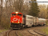 After capturing Surprise # 1 earlier, I drove around Paris to try and setup for my next shot. I ended up in front of the maintenance building at the Market / Broadway St. crossing. Here on the bend, I heard a horn blow. Not knowing what was coming, I couldn't believe my eye as I looked through my viewfinder. 
<br> 
In the right spot, and at the right time...CN's Track Maintenance Evaluation System train O999 came around the bend with CN 8018 leading, followed by Amtrak 39037, CN 414852 and CN 1057.
<br>
Kudos to other rp.ca contributors who gave information about this train when it made it's trek east earlier in the week. I am lucky enough to be one of the rp.ca contributors to have caught it's return trip. Other contributors that have had their photos posted so far are James Gardiner (at Brantford: <a href="http://www.railpictures.ca/wp-content/uploads/2016/04/CN-8018-1280x743.jpg">http://www.railpictures.ca/wp-content/uploads/2016/04/CN-8018-1280x743.jpg</a>; and Marc Dease (in Sarnia: <a href="http://www.railpictures.ca/wp-content/uploads/2016/04/DSC_6829-1280x849.jpg">http://www.railpictures.ca/wp-content/uploads/2016/04/DSC_6829-1280x849.jpg</a>