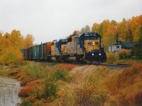 Southbound Cochrane to Englehart train rolls thru the hamlet of Sesekinika by the shore of the lake of the same name. Power is ONR 1731 and 1735, the lead unit off the ONR roster by 2005 when it was sold to Progress Rail.