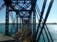 The mighty Niagara River flows quicky under the International Bridge at Fort Erie, Ont. 

Built in 1873, the bridge sees more than 15 trains a day. 

The bridge consists of two sections, the first extending from the Canadian shore to Unity Island and the second extending from Unity Island to the American mainland shore. The portion between these was originally built on a trestle, but was filled to form an embankment soon after the bridge opened.