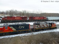 <b>Pushers and assist locomotives, part one: </b> CN 551 is assisting the last M331 out of Hamilton - the crew (including RP.CA contributor and moderator Michael DaCosta) is busy preparing to depart after attaching the 4774 and 7080 to the head end. While this was going on, CP 246 was lined down the hill - all you had to do was wait. This is the second CN/CP meet shot I've attained at this location in 15 or so years of trying :) And it was all serendipity - you can't plan operations like this and you of course, have to be there, and I was already in the area. I'll take it.