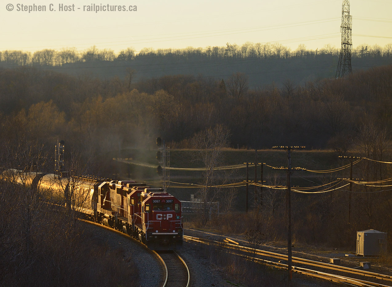 Ontario's pusher territory still continues  At last light,  three gp38-2's in notch 8 fill the air with the sounds and smells of diesel engines doing what they do best - shoving an ethanol train up the Waterdown hill. When this started in 2014 the operation seemed clumsy as some crew needed familiarization with the procedures (while others did not). These days the crews have it down to a science and they are efficient and swift with the adding of, and application of pushers in this relatively new pusher district. Nice show boys, keep up the fine work!
Considering both CN and CP regularly use pushers at this very location, Hamilton West is definitely the place to be, as it was 50 years ago in the days of steam (Anyone have vintage pusher shots from here? Please share! cheers!)