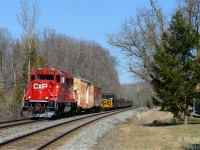 An interesting sight, a new ECO leading an old rail train, filled with 40 and 50 year old modified Gondolas, camp cars... and a MOW caboose at the tail end in the picturesque town of Campbellville Ontario. <br><br>
Operationally, this was interesting - anyone care to shed light to why? The purpose of this run was to drop on on the Hamilton sub, happened as follows<br>
a) Run entire consist into the north track at Guelph Junction<br>
b) 254 takes the Hamilton sub ahead of the rail train<br>
c) 2255 detaches from train, enters OCS under work authority, reverses back into CTC to take the Hamilton sub to wye, re-enters CTC at Guelph Junction 'east'<br>
d) Finishes weing, re-attach to rear of rail train on north track<br>
e) Shove train clear of the CTC into OCS, to take the south track then Hamilton sub connector, rounding the curve at 3 MPH<br>
f)dropping rail between Guelph Junction and Waterdown once clear of the wye track.<br>
Thanks for any and all comments from those in the know. I did not follow, went home due to commitments.





