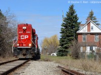 <b>Where it all began</b> for me - this is my origin story - how I got into 'trains'. We all have our story and this is mine: Back in 1978 when I was about 1 my parents bought a house in Brampton right beside what was then the CPR Owen Sound subdivision on English St. These were brick townhomes and fairly new, there was little in the way of vegetation and you could easily see the trains passing from not only the back window but my parents bedroom window, and I quickly grew to know this. Where I'm standing in this photo is precisely the location I would have looked at - the townhouses are just to the left. My mom told me a story many years ago, when I was 2, she would find me downstairs looking out the back porch window watching a train, having thrown myself behind the curtain, whispering in toddler language: <br><br>"Boxcar... tank car... boxcar...." then at the top of my lungs: "CABOOSE!" <br><br>A cute story to imagine - I do have memories of trains and speeders that passed, and it seemed far busier back then - considering the volume of trains that would run to Orangeville and up the branches to Owen Sound and Elora, plus the CNR interchange track. By 1981 we moved to Meadowvale and any tracks were a bit of a drive away. But the seed had been planted and it never left me. Thanks to an encouraging Grandfather (<b>Maurice 'mo' Swainson</b>, passed in '89, RIP) who was into model trains and part of a model train club (not quite sure which one! was either in Clarkson and/or Burlington areas - anyone remember? His prized possession was an orange French TGV set! - PM me if you remember!) and my dad who took me to many tracks for entertainment, I was always somewhat in touch with the railways in some way or another. In 1988 on a trip to Toronto I bought along with me a camera and did take some train photos (including a CP at USRC!), but I lost one of the rolls and only processed one. I should have kept going, but didn't bother again until finishing university , with a job and some cash, bought a camera and I'm still at it today :)<br><br>Ahh memories. I'd been longing to make this nostalgic trip one day and of course, it had to be when OBRY would be granted another CPR loaner unit. Long hood forward sure looks different... doesn't it.<br><br>What's your origin story? Share one if you find the time and the photo to go with it :) Thanks for reading!