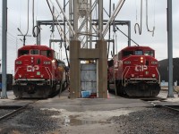 2 of the 4 SD60M's painted up in Canadian Pacific occupy the 2 tracks of the servicing island at the same time.