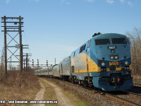 VIA 907 leads eastbound train 64 slowly around the bend as it approaches the station. Time of arrival is approximately 12:30 pm.